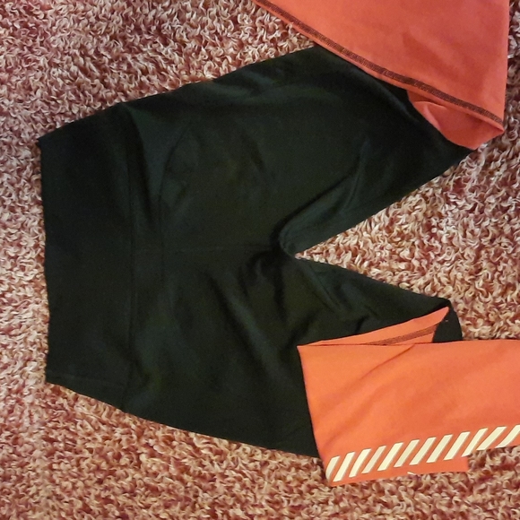 Nike leggings.  Mesh bottom from the knee down. Size small. Black and a pink. - Picture 4 of 4